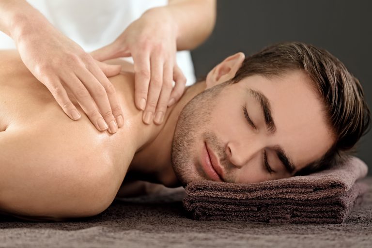 Man having massage in spa salon
